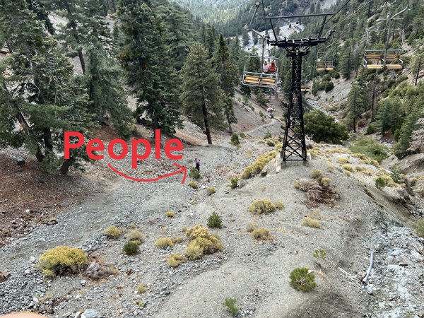 Two People walking down the mountain 