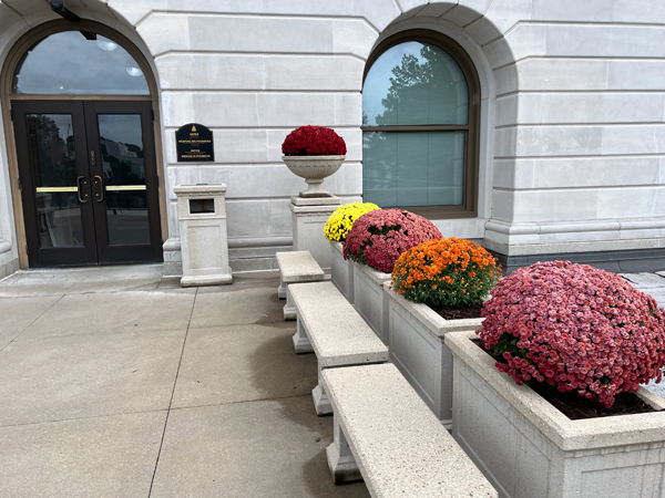 big flower pots and a locked  door