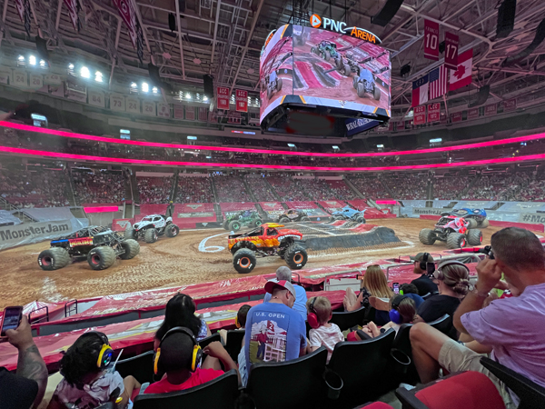 eight Monster Trucks struting their stuff