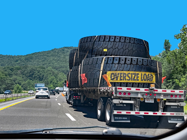 truck hauling very big  over-sized ites