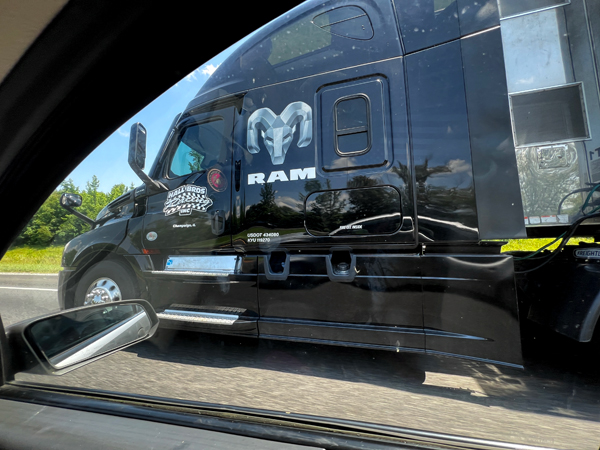 semi with Monster Truck inside