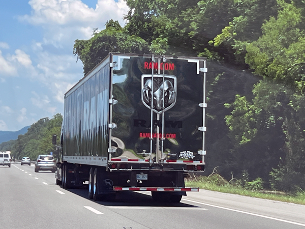 semi with Monster Truck inside
