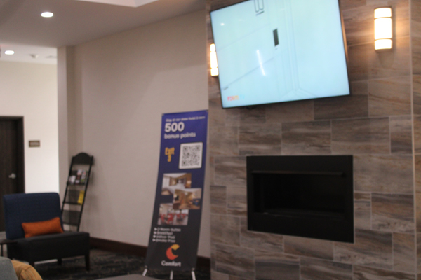 TV and fireplace in the small lounge area