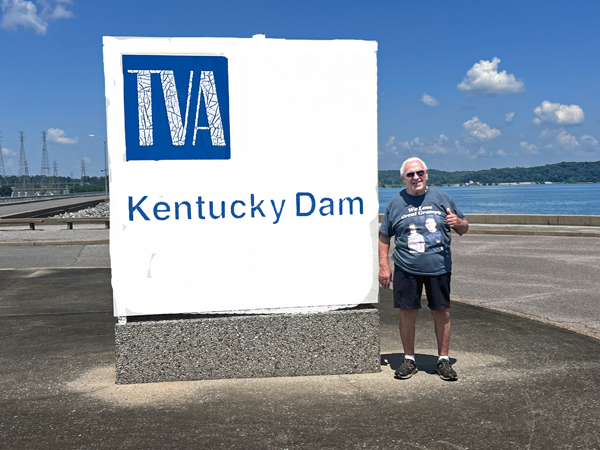 Lee Duquette at the TVA Kentucky Dam sign