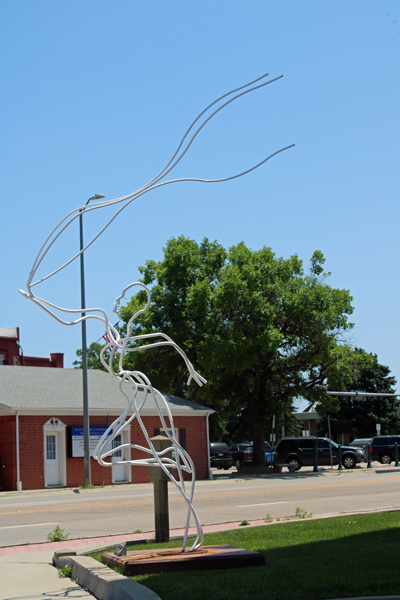 wind sculpture and person