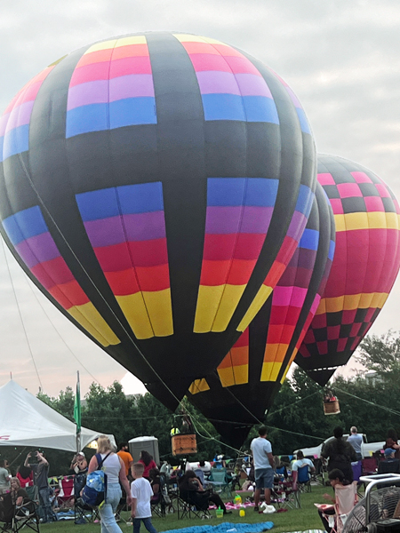 three hot air balloons