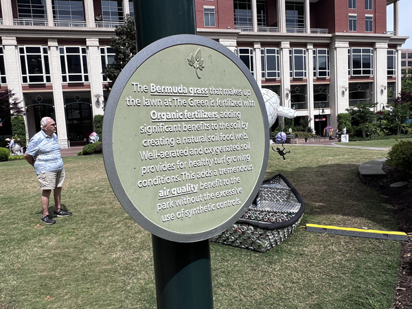 Lee Duquette and a sign