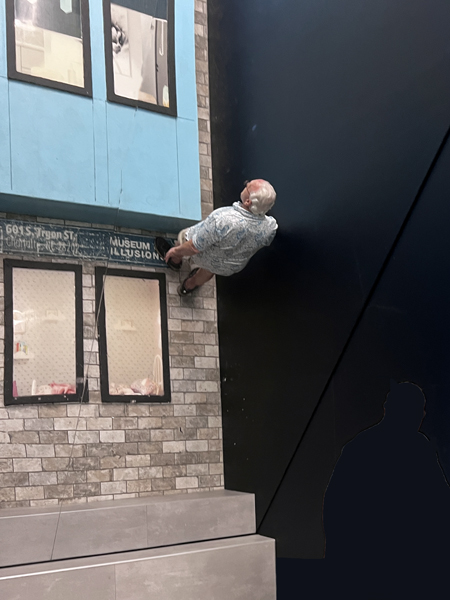 Lee Duquette walking on the building