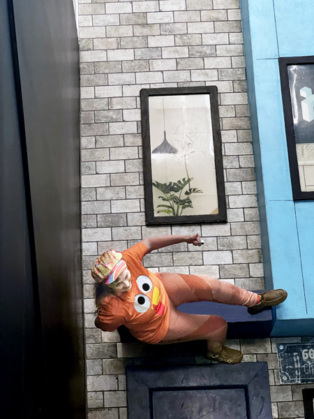 Karen Duquette walking on the building