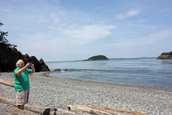 Lee Duquette taking photos of the beach and bridge