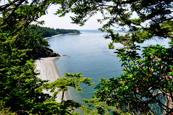 view looking down from the bridge to the beach