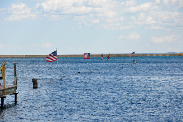 buoys in the water that also carry the USA Flag