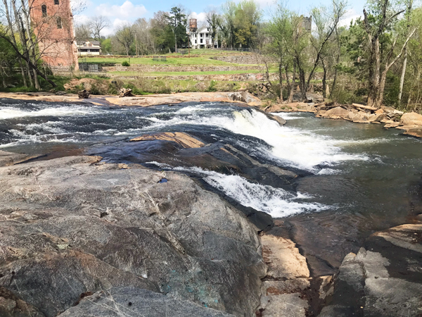 remains of the cotton mill and the waterfall