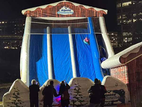 child and tube on the Alpine Avalanche slide