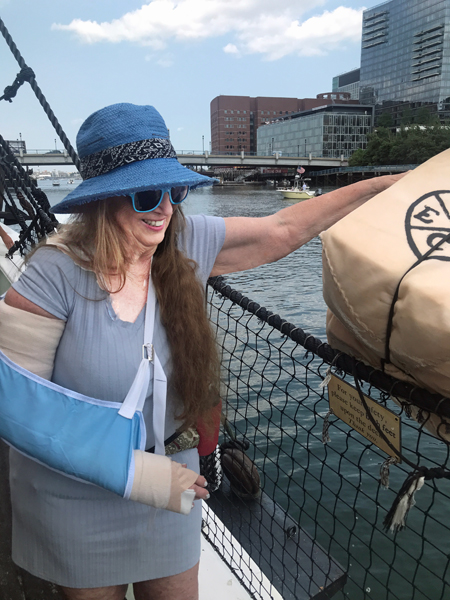 Karen Duquette throwing tea overboard