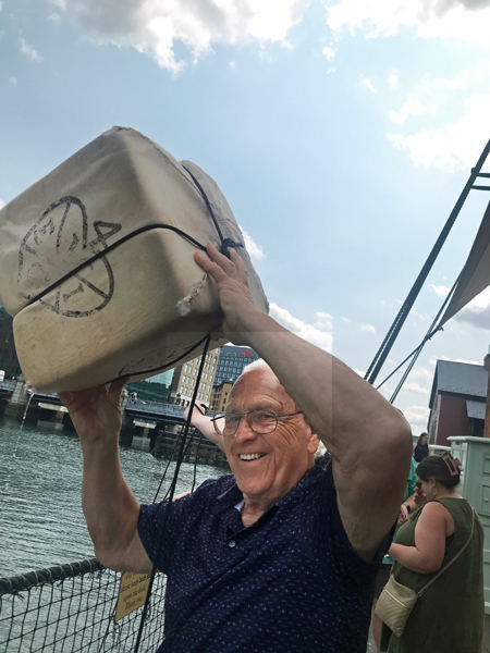 Lee Duquette throwing tea overboard