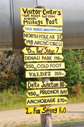 sign - visitor center mileage post