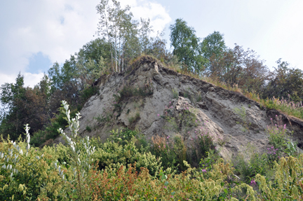 dirt mound on the upper trail by the pipeline