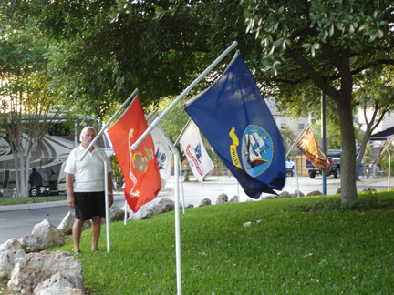 Lee Duquette and flags in the park